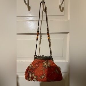Elegant brass and Floral Embroidered Orange Bag